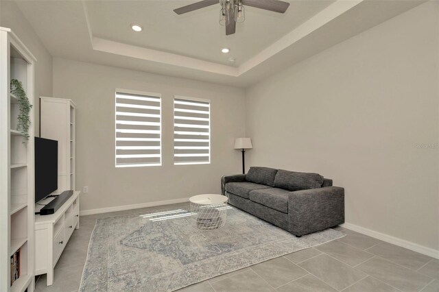 3504 Golden Wheat Ln, Plant City, FL 33565 - sitting room featuring ceiling fan, recessed lighting, baseboards, a raised ceiling, and light tile patterned floors