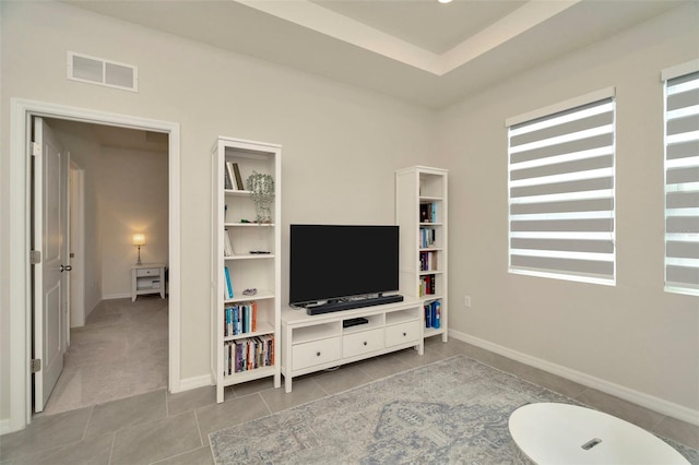 3504 Golden Wheat Ln, Plant City, FL 33565 - living area featuring tile patterned flooring and baseboards