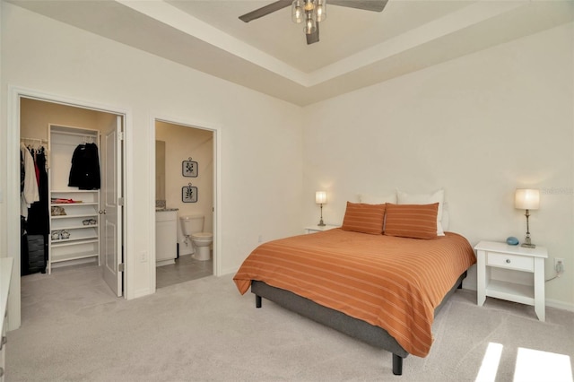 3504 Golden Wheat Ln, Plant City, FL 33565 - bedroom featuring a spacious closet, light colored carpet, a closet, and baseboards
