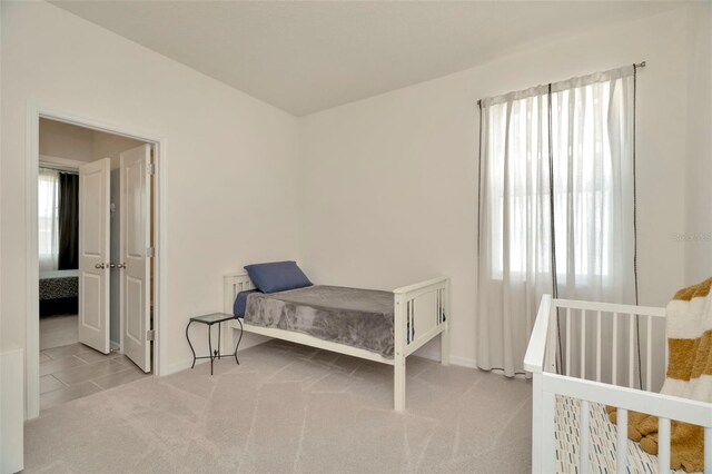 3504 Golden Wheat Ln, Plant City, FL 33565 - carpeted bedroom with multiple windows and baseboards