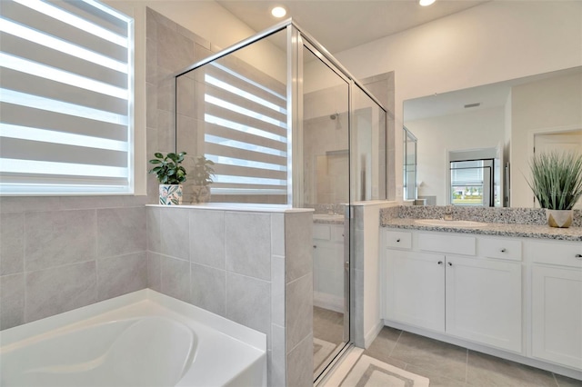 3504 Golden Wheat Ln, Plant City, FL 33565 - full bath with vanity, a garden tub, a stall shower, tile patterned floors, and recessed lighting