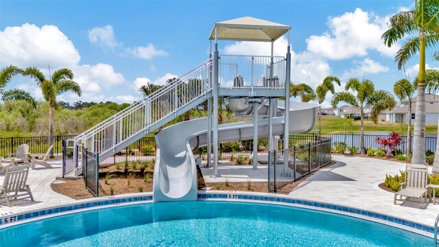 3504 Golden Wheat Ln, Plant City, FL 33565 - community pool with a water slide, a patio area, and stairway