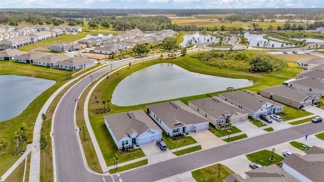 3504 Golden Wheat Ln, Plant City, FL 33565 - aerial perspective of suburban area with a large body of water