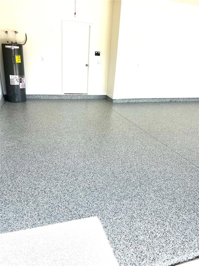 3504 Golden Wheat Ln, Plant City, FL 33565 - garage with electric water heater and baseboards