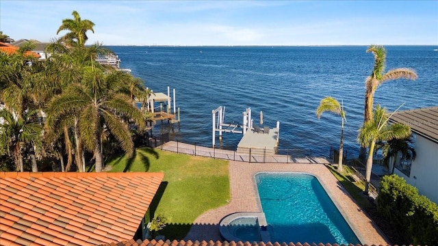 exterior space featuring boat lift, a water view, and a fenced in pool