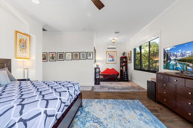 bedroom with a ceiling fan, baseboards, ornamental molding, and wood finished floors