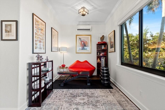 interior space featuring baseboards, ornamental molding, and a wall mounted AC