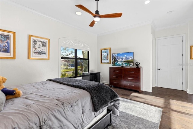 bedroom with ornamental molding, baseboards, dark wood-style flooring, and recessed lighting