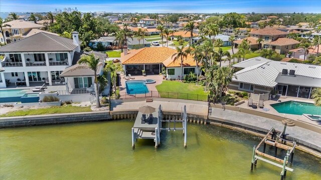 exterior space with a residential view and a water view