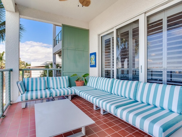 exterior space with ceiling fan, a balcony, and an outdoor living space