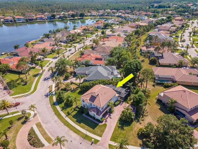 aerial view with a residential view and a water view