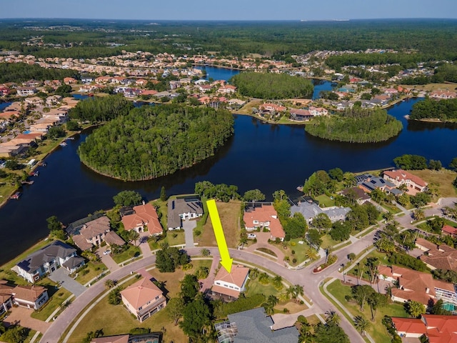 drone / aerial view with a water view and a residential view