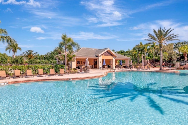 pool featuring a patio and fence