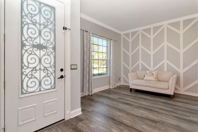 foyer featuring baseboards, ornamental molding, and dark wood-type flooring