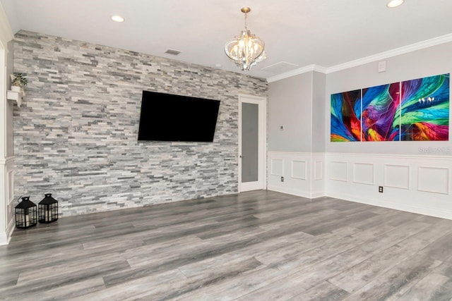 unfurnished living room with wood finished floors, visible vents, recessed lighting, and a notable chandelier