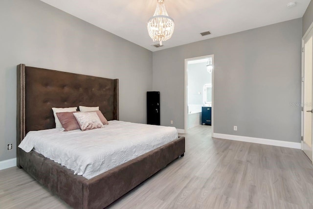 bedroom featuring connected bathroom, visible vents, baseboards, an inviting chandelier, and light wood-type flooring