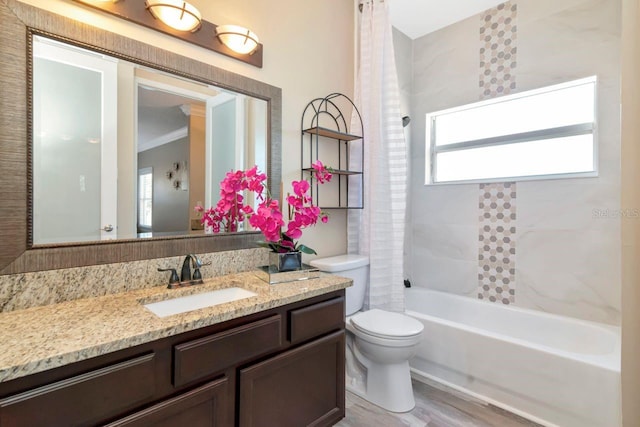 full bath featuring toilet, shower / bathtub combination with curtain, wood finished floors, and vanity