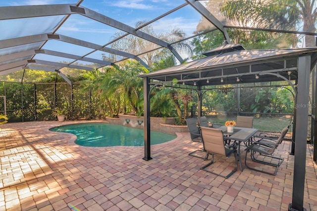 outdoor pool with a patio, a gazebo, and glass enclosure