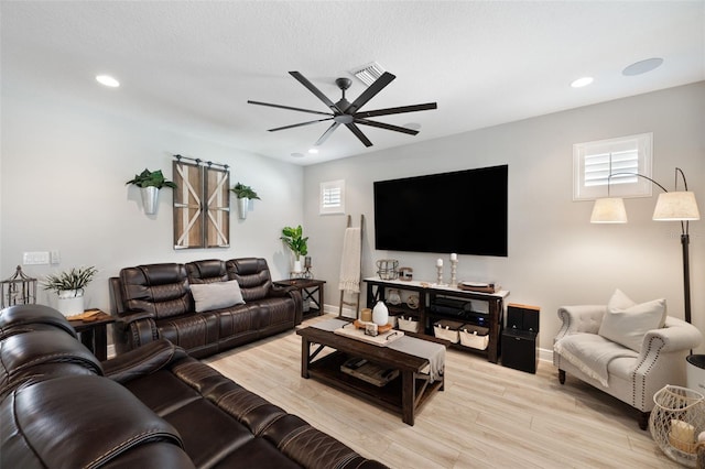 living area featuring light wood finished floors, recessed lighting, and ceiling fan