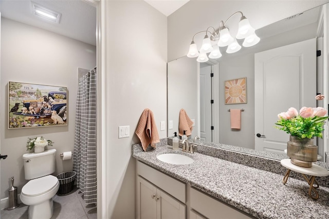 full bath featuring a shower with shower curtain, tile patterned flooring, vanity, and toilet