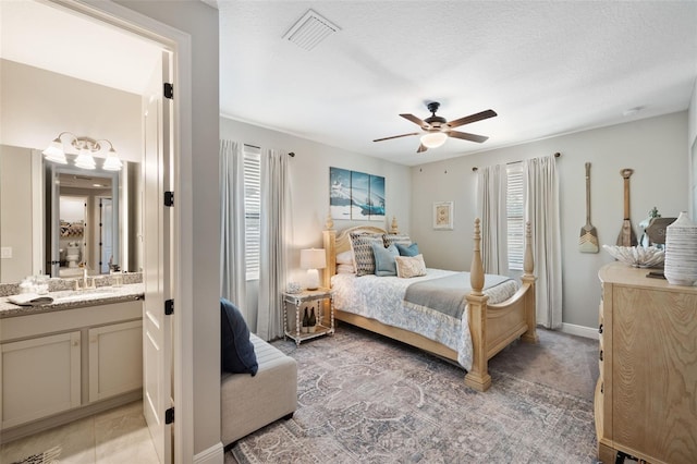 bedroom featuring light carpet, visible vents, and ceiling fan