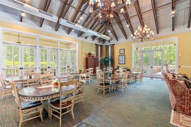 dining space featuring beamed ceiling, french doors, an inviting chandelier, and high vaulted ceiling