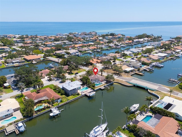 birds eye view of property with a residential view and a water view