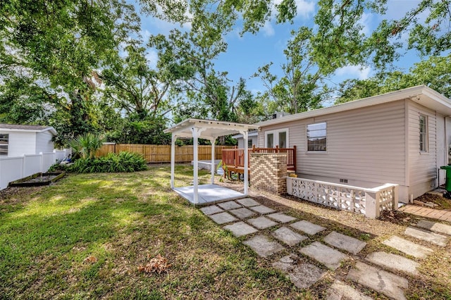 rear view of house featuring a fenced backyard, a yard, and a patio