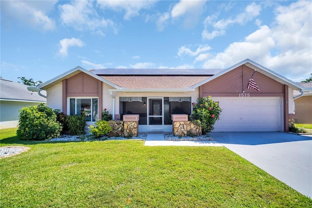 1575 Wicklow Dr, Palm Harbor, FL 34684 - ranch-style house featuring solar panels, concrete driveway, an attached garage, a front yard, and stucco siding