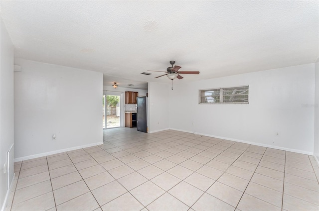 222 Aldo Dr, Babson Park, FL 33827 - empty room with ceiling fan, light tile patterned floors, baseboards, and a textured ceiling