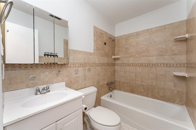 222 Aldo Dr, Babson Park, FL 33827 - bathroom featuring shower / bath combination, tile walls, toilet, and vanity