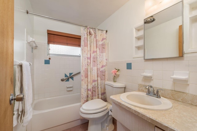full bath with shower / bath combo with shower curtain, tile patterned flooring, wainscoting, toilet, and tile walls