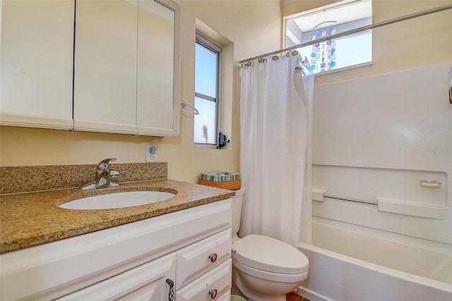 bathroom with vanity, toilet, and shower / tub combo with curtain