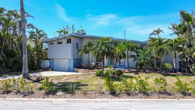 view of front of home featuring a garage and concrete driveway