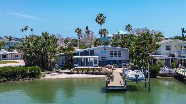 view of dock featuring boat lift and a water view