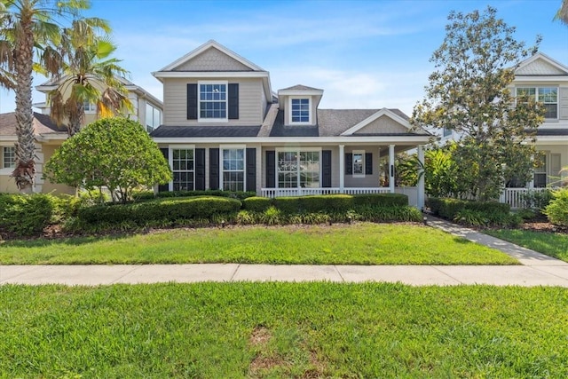 20113 Bending Creek Pl, Tampa, FL 33647 - view of front of home featuring a front yard and covered porch