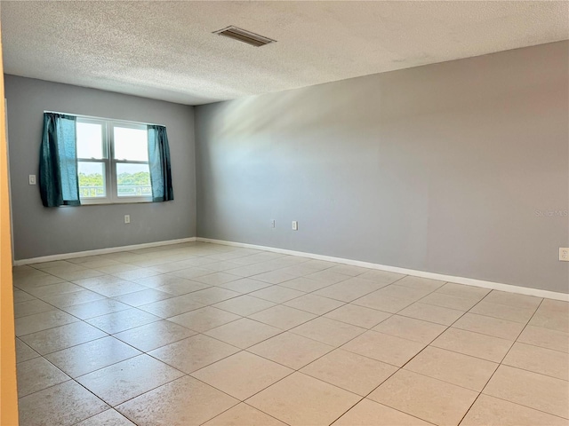 5501 80th St N Unit 509, Saint Petersburg, FL 33709 - unfurnished room featuring a textured ceiling and light tile patterned flooring