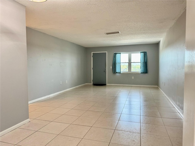 5501 80th St N Unit 509, Saint Petersburg, FL 33709 - empty room with a textured ceiling and light tile patterned floors