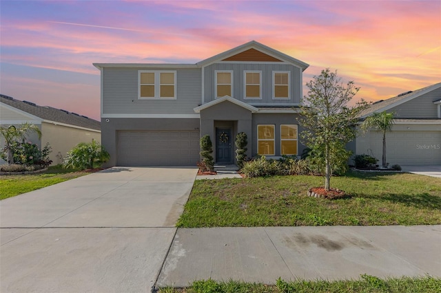 1646 Seth Dr, Winter Haven, FL 33880 - view of front of house with an attached garage, driveway, a yard, and stucco siding