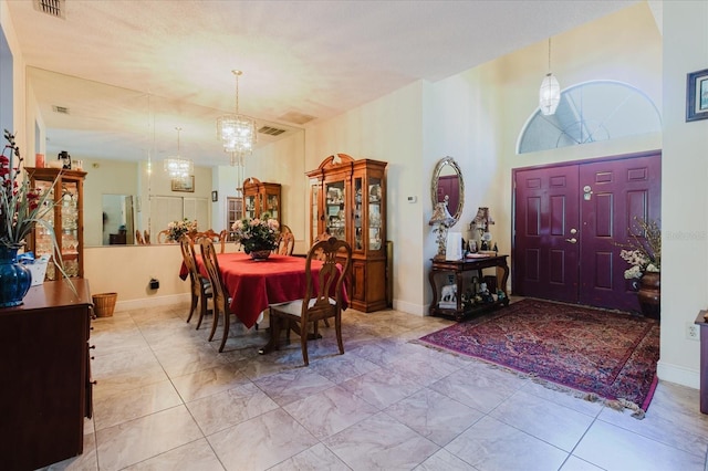 11209 Pocket Brook Dr, Tampa, FL 33635 - dining room with visible vents, marble finish floor, and a notable chandelier