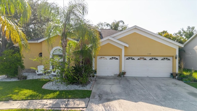 11209 Pocket Brook Dr, Tampa, FL 33635 - single story home featuring an attached garage, a front lawn, stucco siding, and driveway