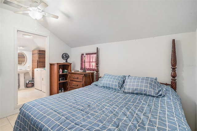 bedroom featuring separate washer and dryer, a ceiling fan, light tile patterned floors, lofted ceiling, and visible vents