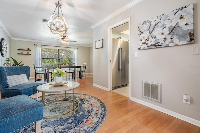 34 Hickory Ln, Safety Harbor, FL 34695 - living area featuring light wood-style floors, visible vents, crown molding, and ceiling fan