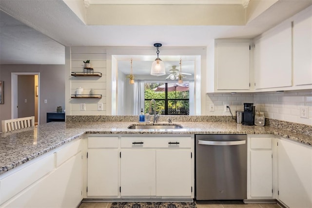 34 Hickory Ln, Safety Harbor, FL 34695 - kitchen with a sink, backsplash, white cabinetry, light stone counters, and dishwasher