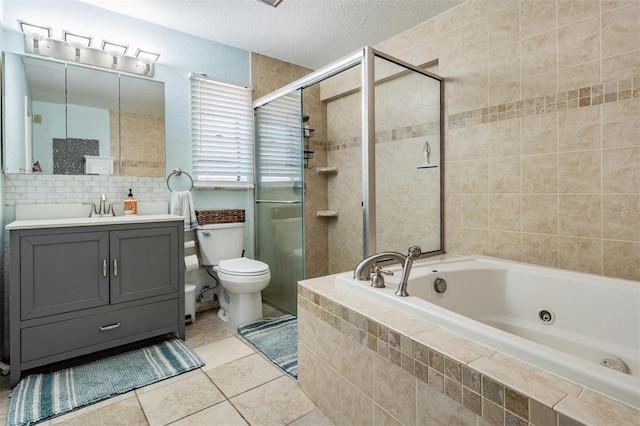 34 Hickory Ln, Safety Harbor, FL 34695 - full bathroom featuring a shower stall, tile patterned flooring, a whirlpool tub, and a textured ceiling