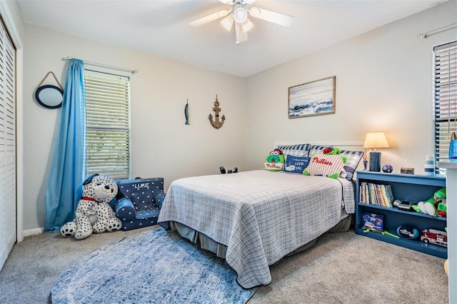 34 Hickory Ln, Safety Harbor, FL 34695 - carpeted bedroom with a ceiling fan and a closet