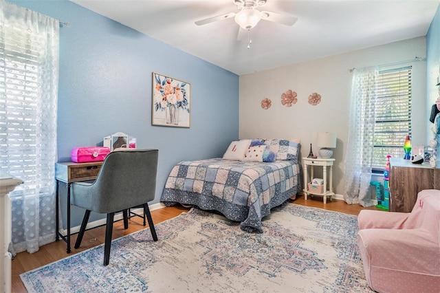 34 Hickory Ln, Safety Harbor, FL 34695 - bedroom with baseboards, a ceiling fan, and wood finished floors