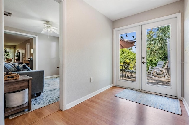 34 Hickory Ln, Safety Harbor, FL 34695 - doorway featuring baseboards, a ceiling fan, light wood-style floors, and visible vents