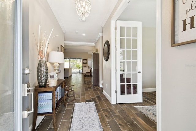 11852 Lake Lucaya Dr, Riverview, FL 33579 - foyer with crown molding, baseboards, an inviting chandelier, and wood tiled floor