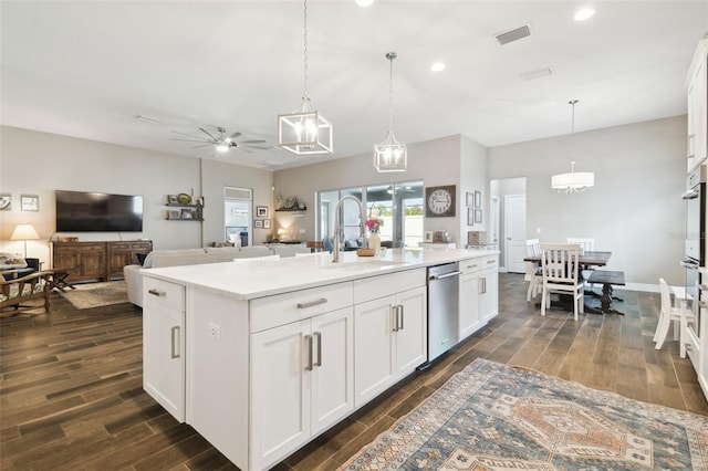 11852 Lake Lucaya Dr, Riverview, FL 33579 - kitchen with a sink, visible vents, dark wood finished floors, and dishwasher
